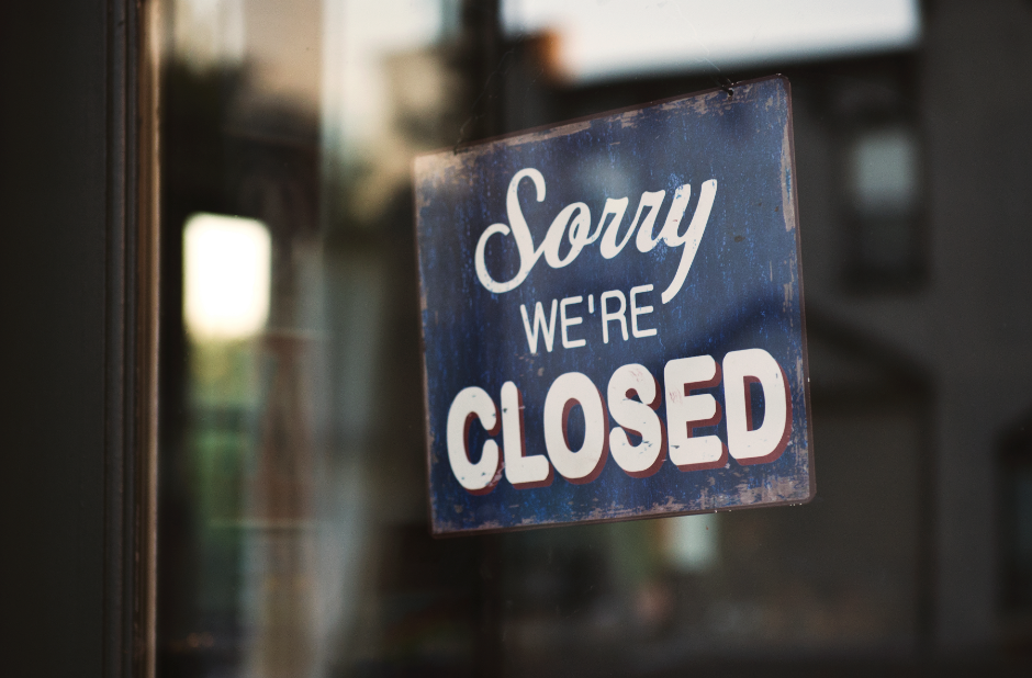 Sign in a window that says sorry we're closed.