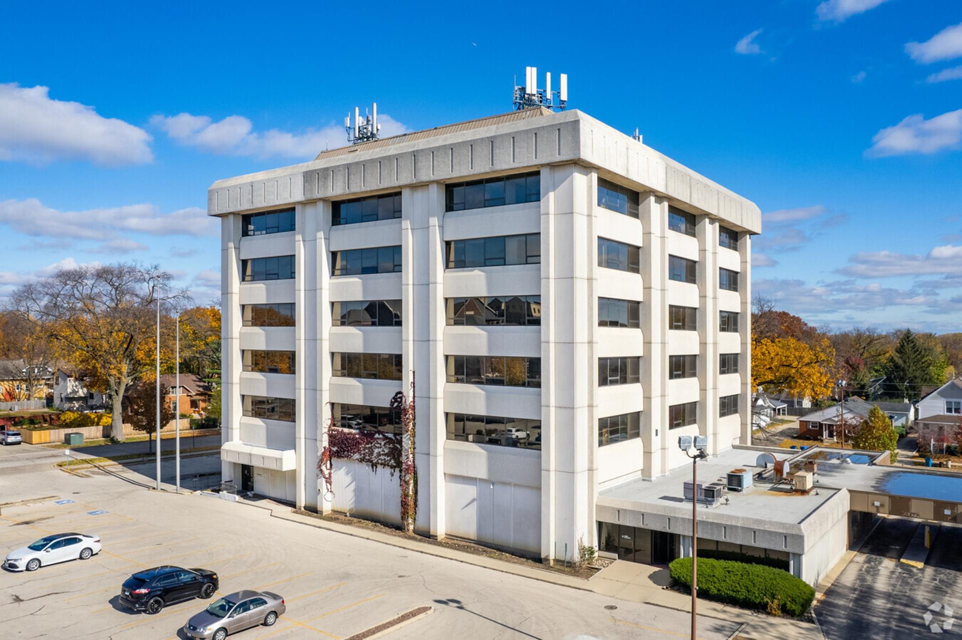 Full view of the site at 111 East Busse Avenue showing the former Chase Bank building on the property.
