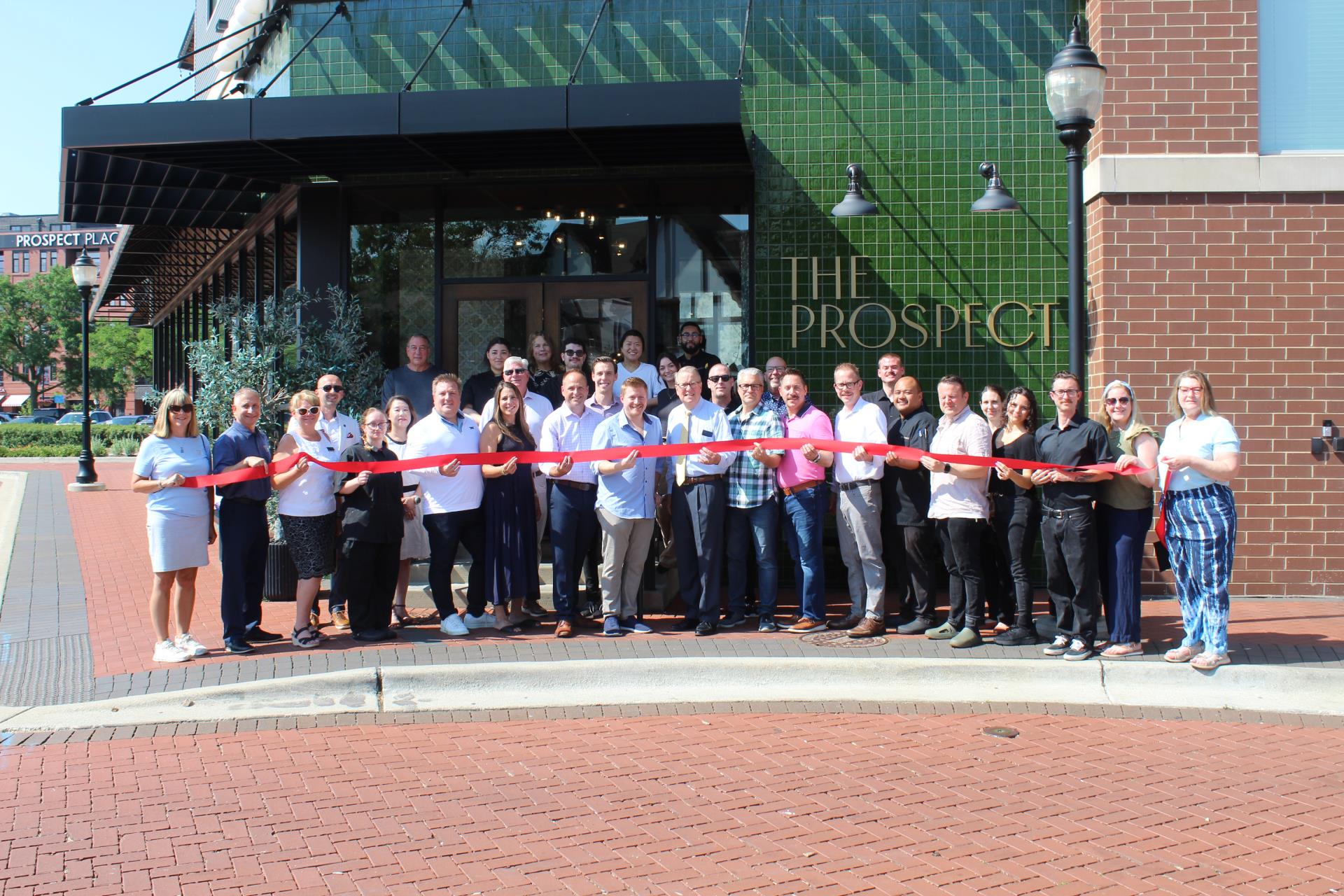 The Prospect 1 year anniversary ribbon tying