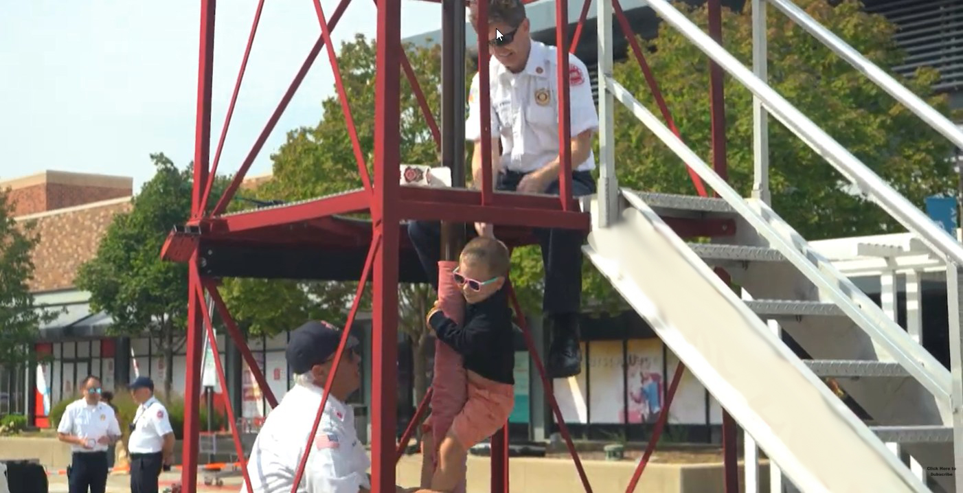 Kid going down fire pole